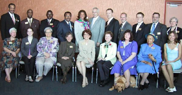 2002 Celebrate Volunteers awardees.  Awards presented by Carmen Harlan, Senior News Anchor, Channel 4 TV, with colorful scarf just behind Wendy, and Paul W. Smith, Morning Show Host for 760 WJR radio host in gray suit on her left